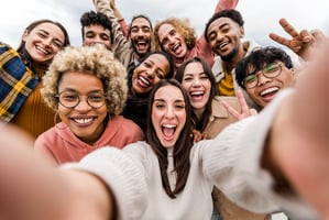 Diverse business team collaborating in a modern workplace, representing mYngle’s corporate language training and employment development solutions.
