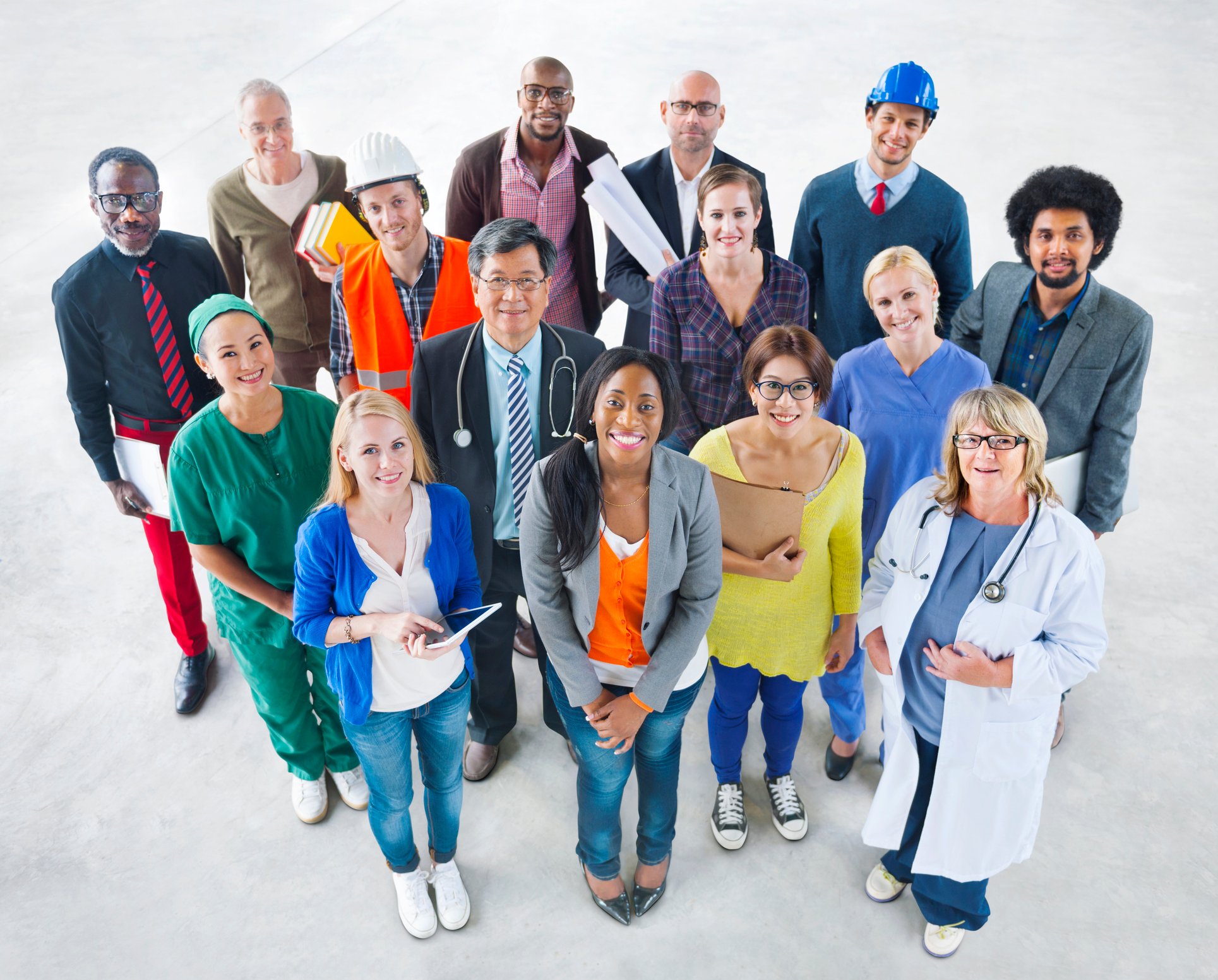 Group of professionals from diverse industries standing together, including doctors, nurses, engineers, and office workers, representing industry-specific communication needs.