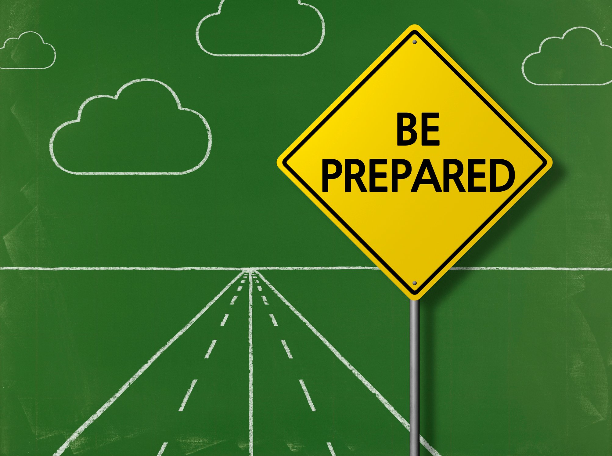 Yellow road sign reading ‘Be Prepared’ on a chalkboard road background, symbolizing long-term competency and readiness for sustainable skills development